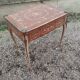 Antique game table in Louis XVI style with marquetry.