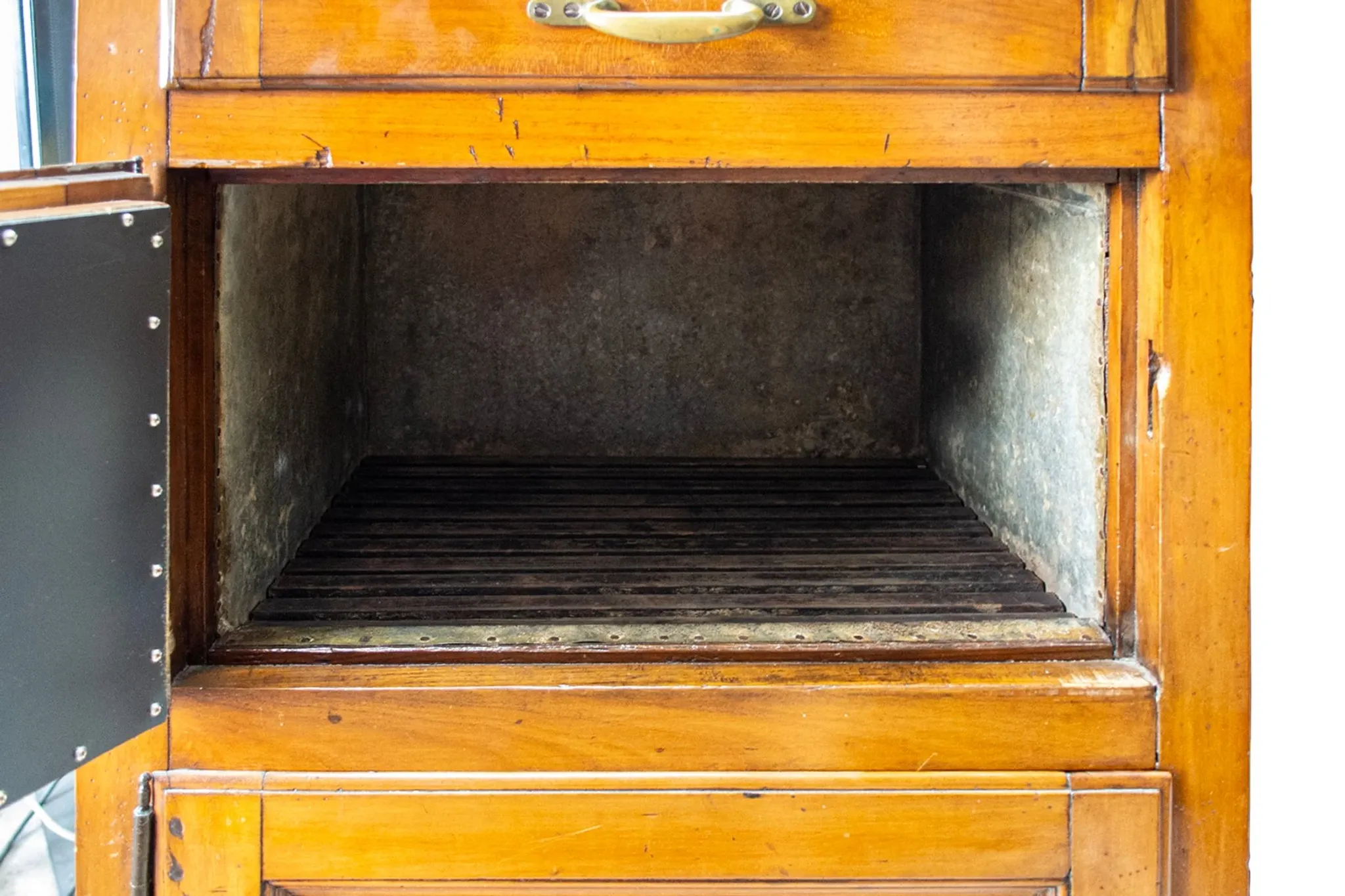 Antique icebox with brass details, Italy, late 19th century.