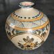 Vintage vase shaped terracotta ball with handheld paint decoration polychrome signed