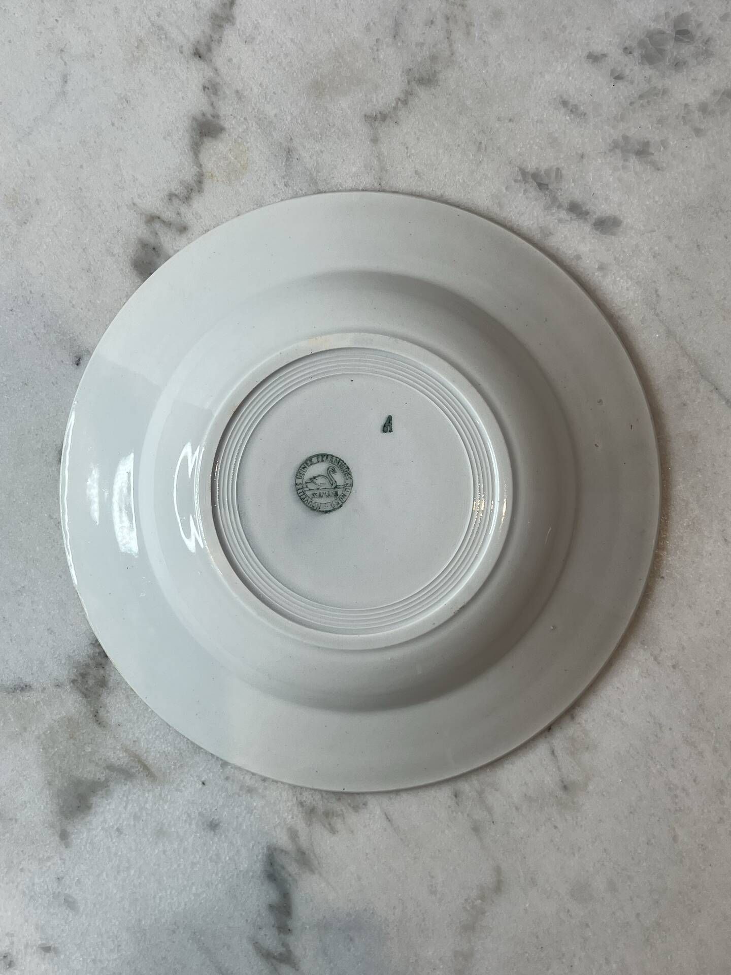 Set of 4 deep plates from Saint Amand with laurel wreath decoration.