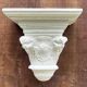Carved wooden wall bracket
