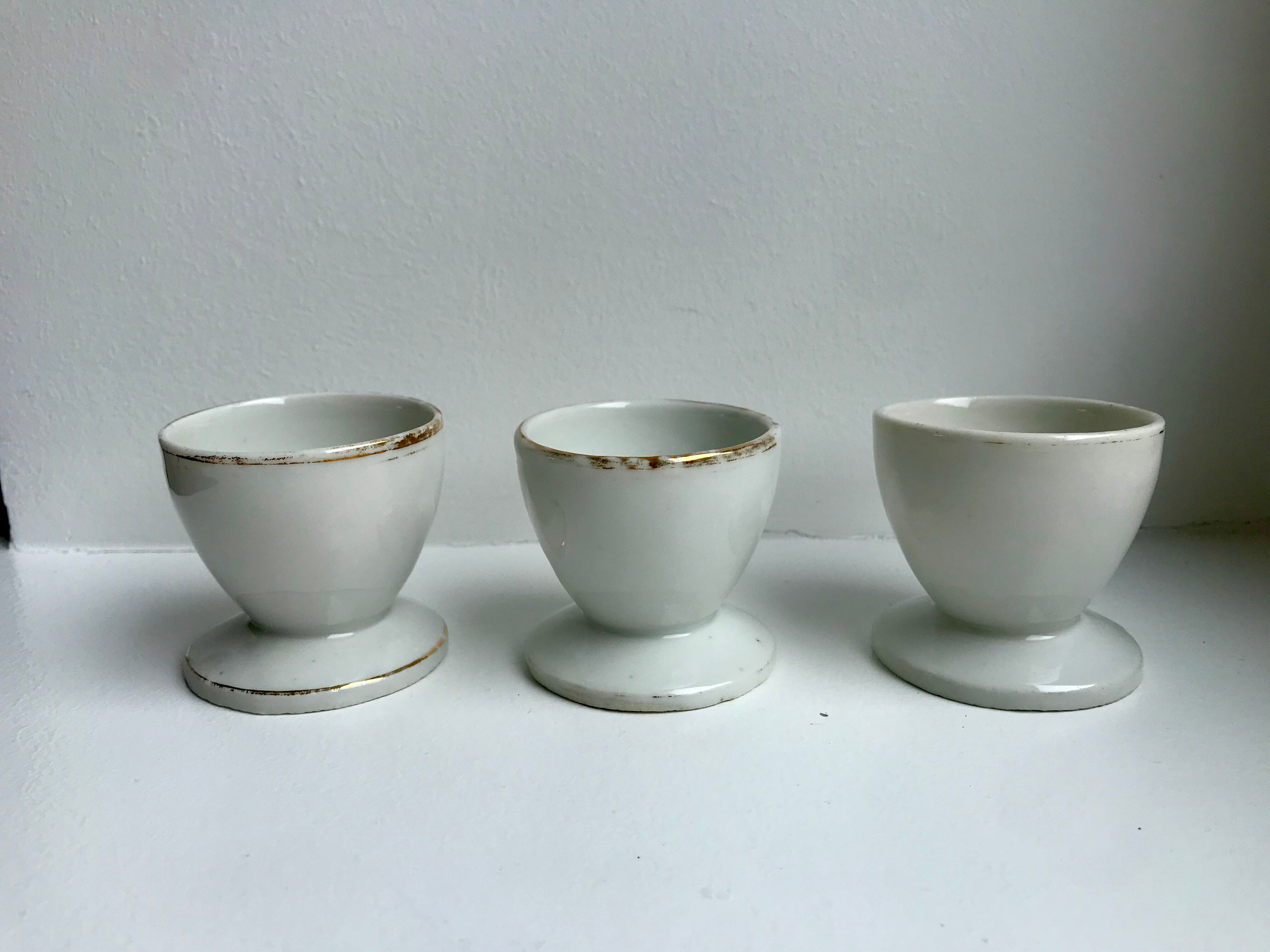 Trio of white shells bordered gold 50s