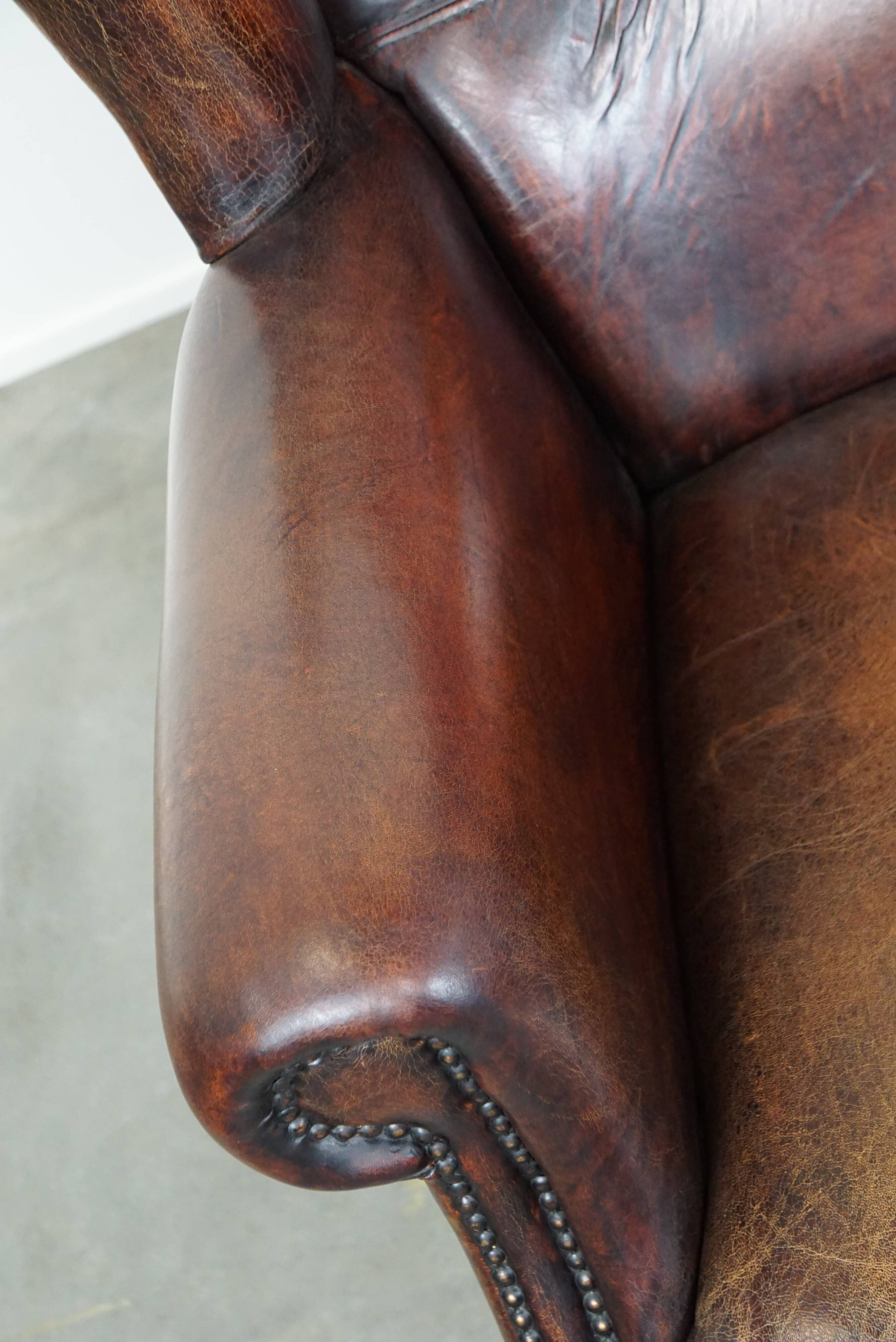 Large Sheepskin Leather Wingback Armchair with a Fixed Seat Cushion and a Stunning Patina