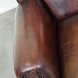 Large Sheepskin Leather Wingback Armchair with a Fixed Seat Cushion and a Stunning Patina