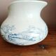 Old bulbous jug in ironstone earthenware