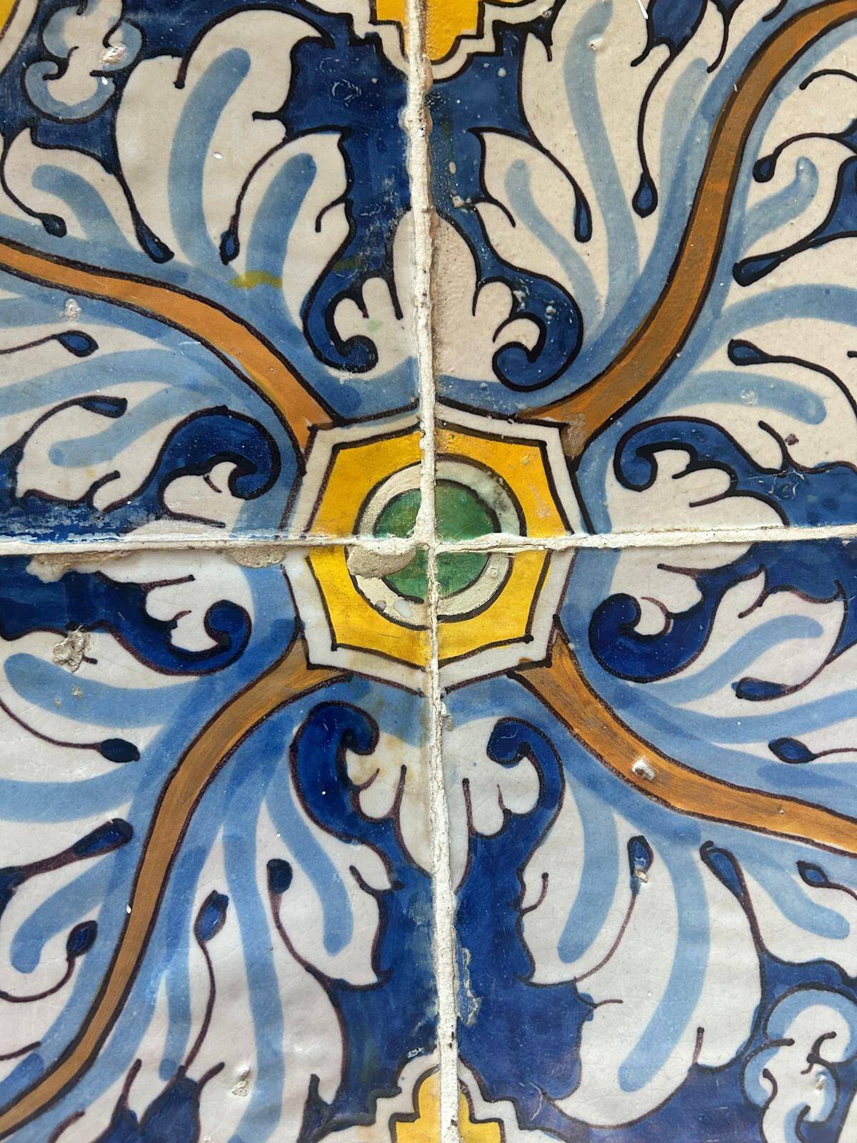 Panel of four Catalan tiles, 17th century, framed.