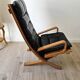 Scandinavian armchair in wood and leather.