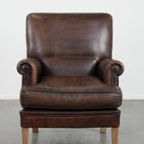 Characterful sheep leather armchair with a beautiful deep colour