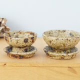 Pair of vergy speckled sandstone candle holders, vintage