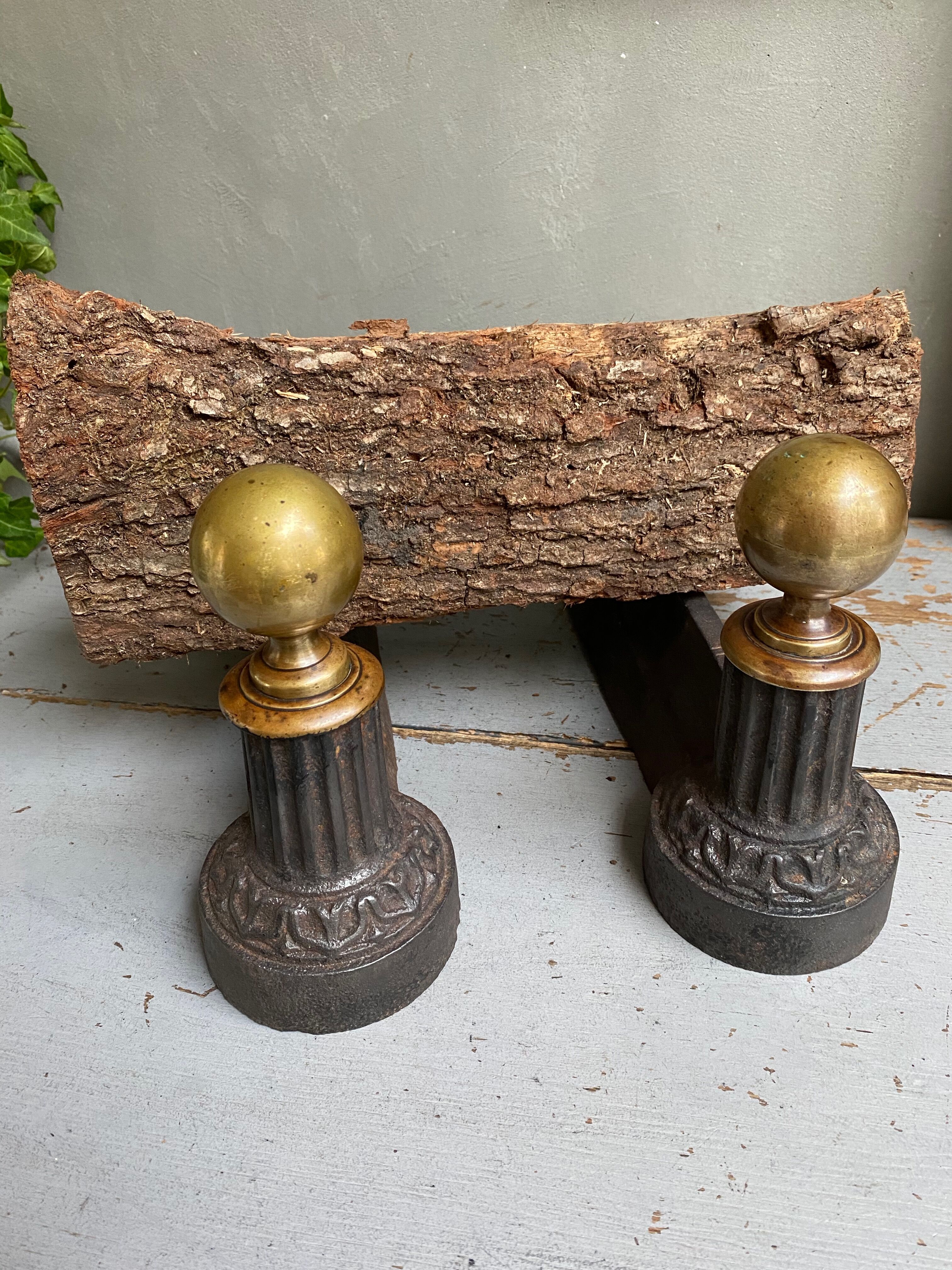 Pair of cast iron and brass chenets