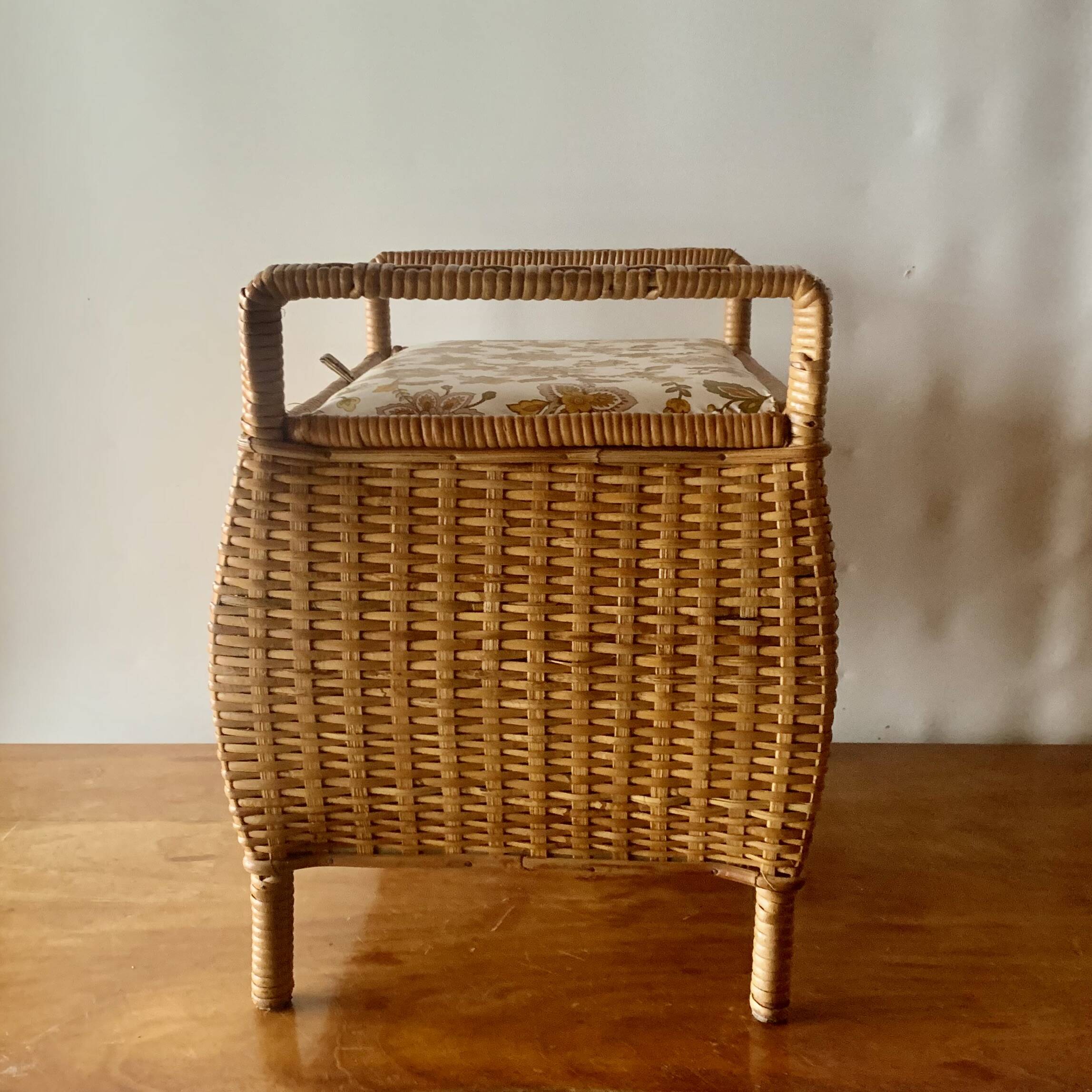 Large vintage rattan and wicker sewing basket with floral decor seat