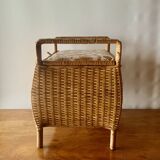 Large vintage rattan and wicker sewing basket with floral decor seat