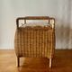Large vintage rattan and wicker sewing basket with floral decor seat