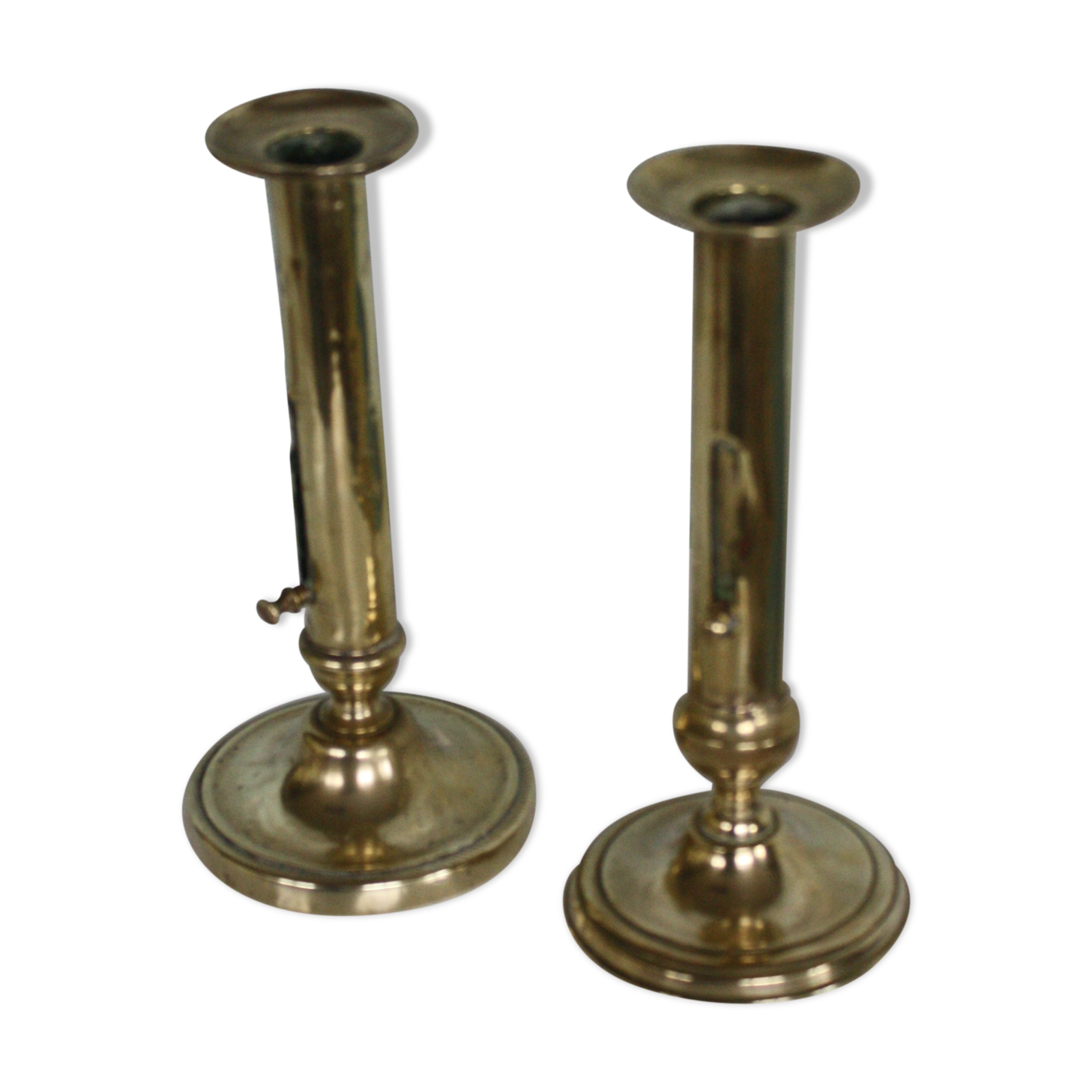 Pair of brass push-up candlesticks