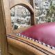 Pair of studded burgundy leather Art Deco chairs