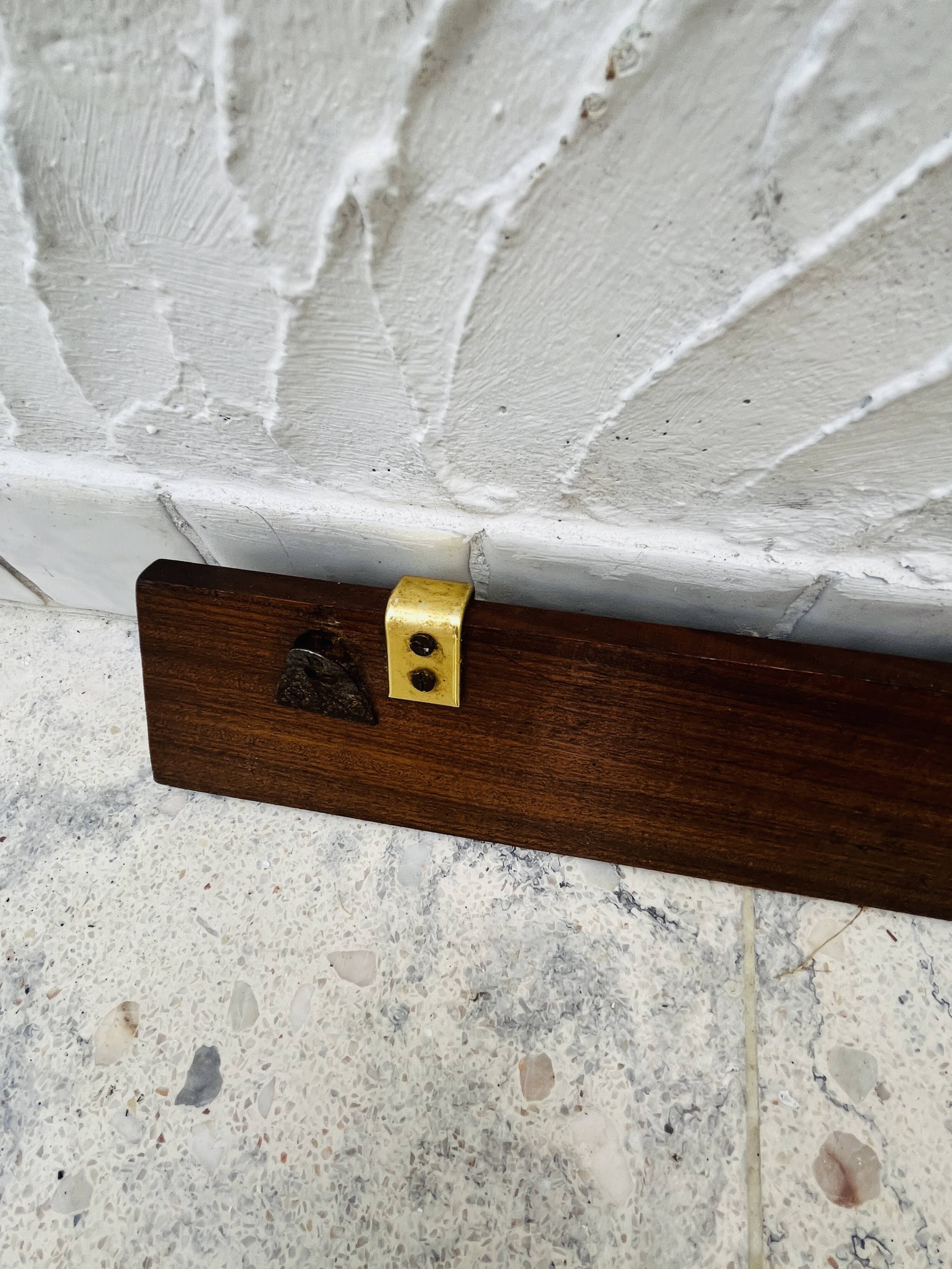 Vintage wooden and brass coat rack with 3 hooks from the 1960s.
