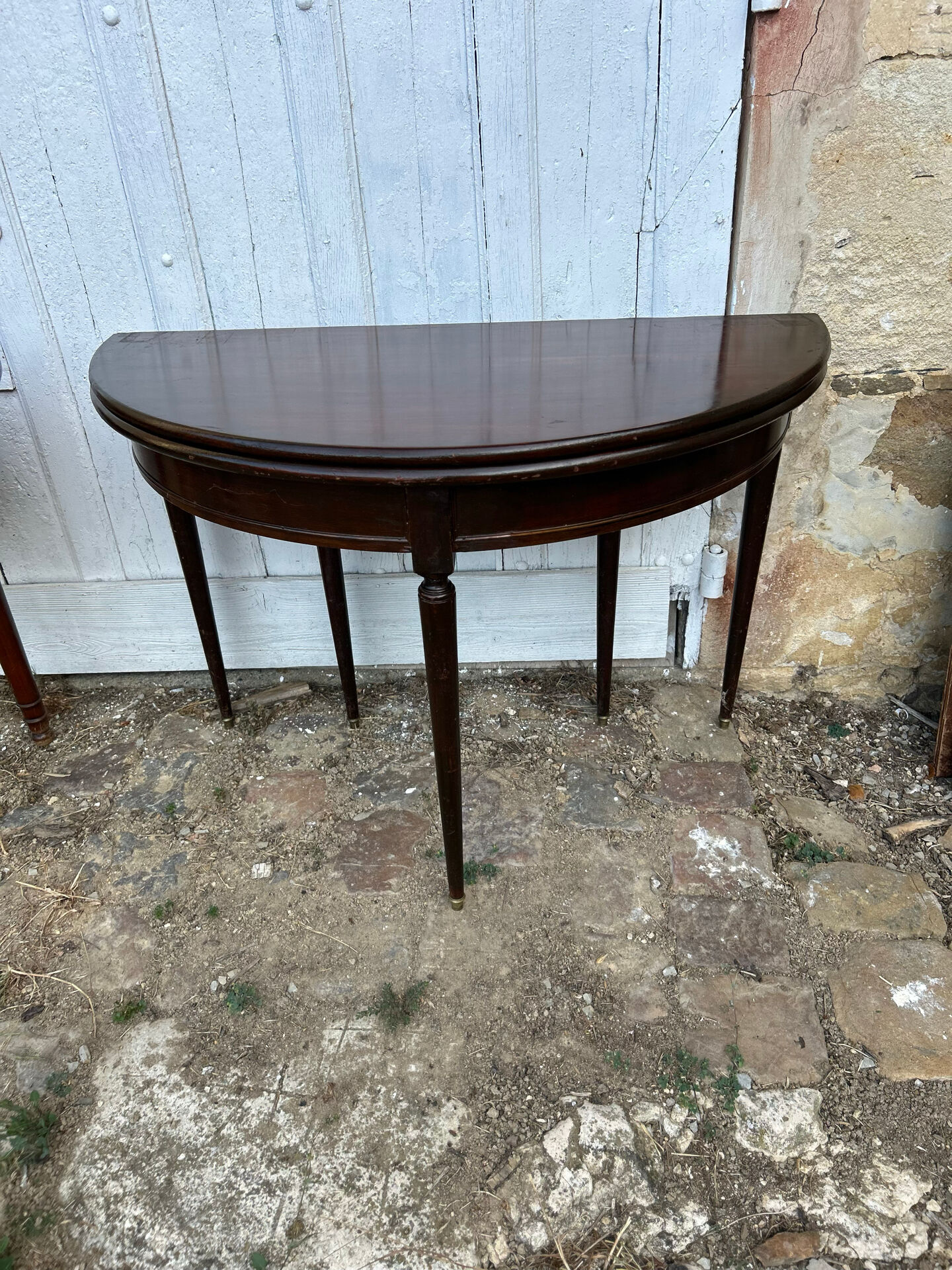 Half-moon table in mahogany, Louis XVI style.