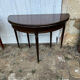 Half-moon table in mahogany, Louis XVI style.