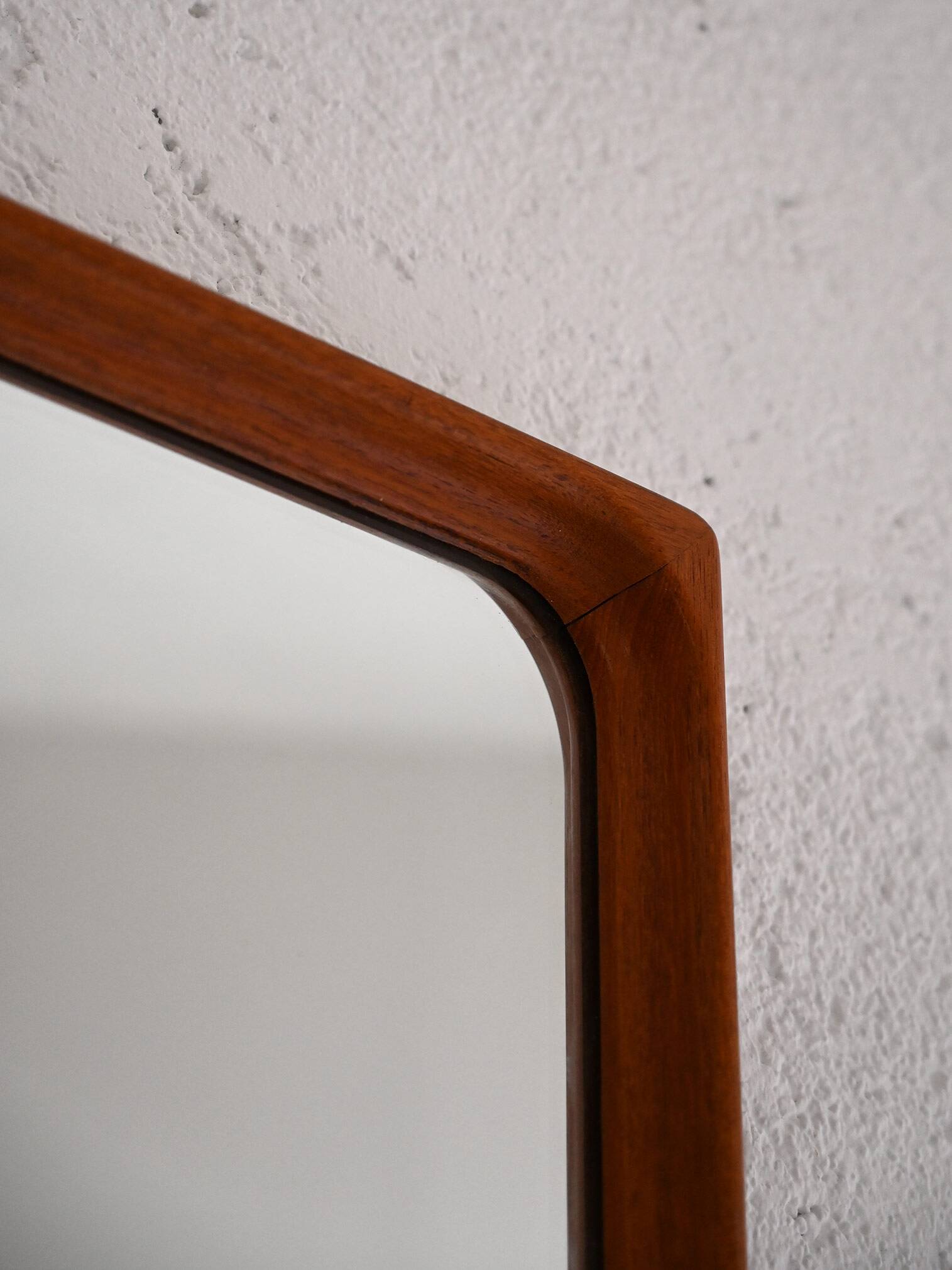 Vintage half-bust mirror with wooden frame