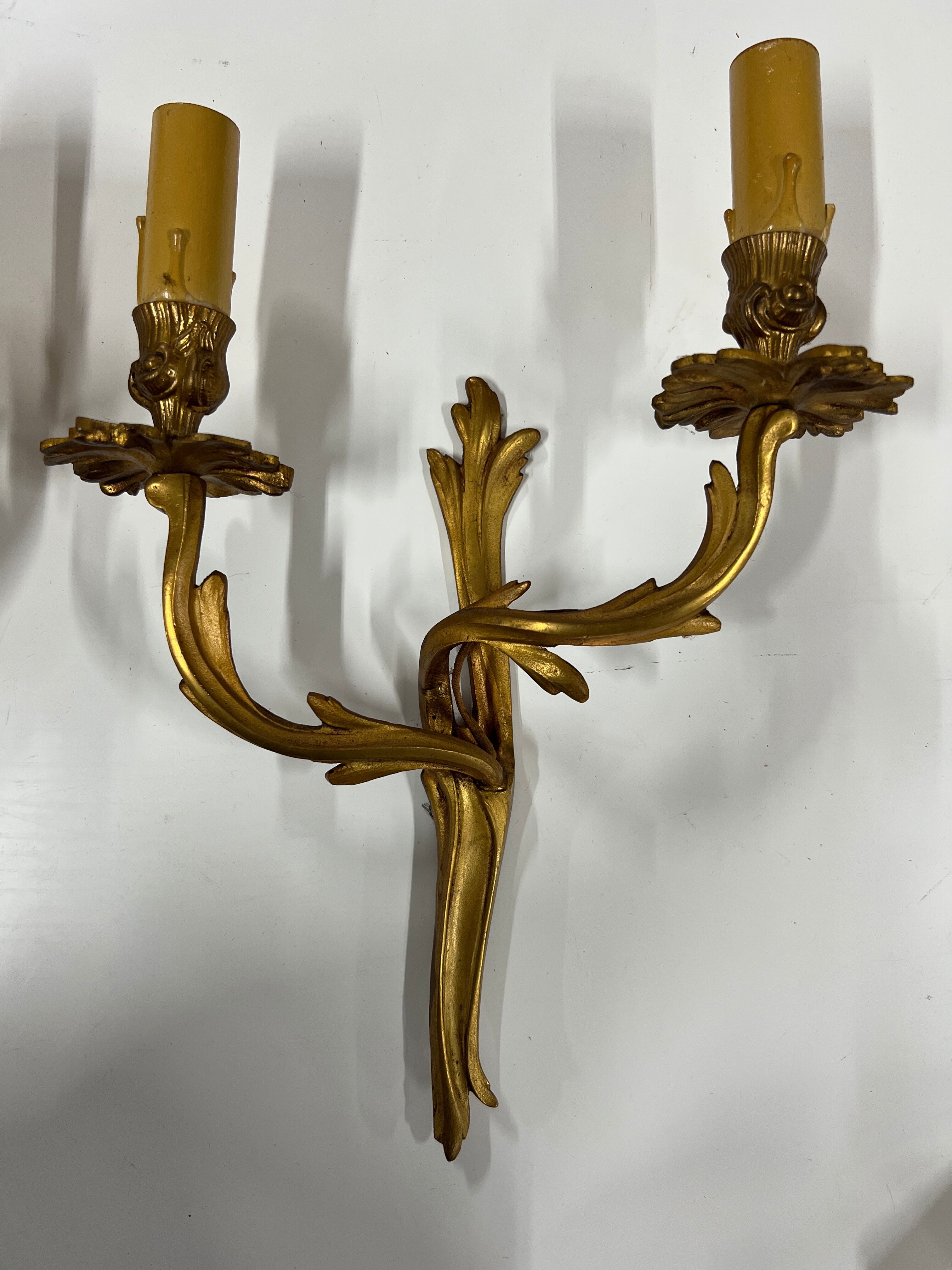 Pair of Louis XV wall lamps in gilded bronze