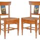 Pair of chairs with barrette backs and bands painted with animated landscapes
