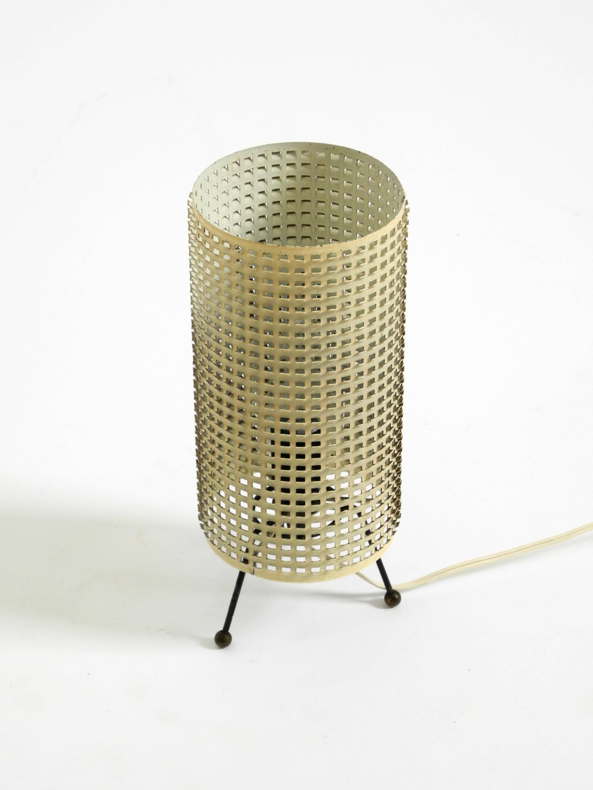 Original 1950s brass tripod table lamp with a perforated metal lampshade