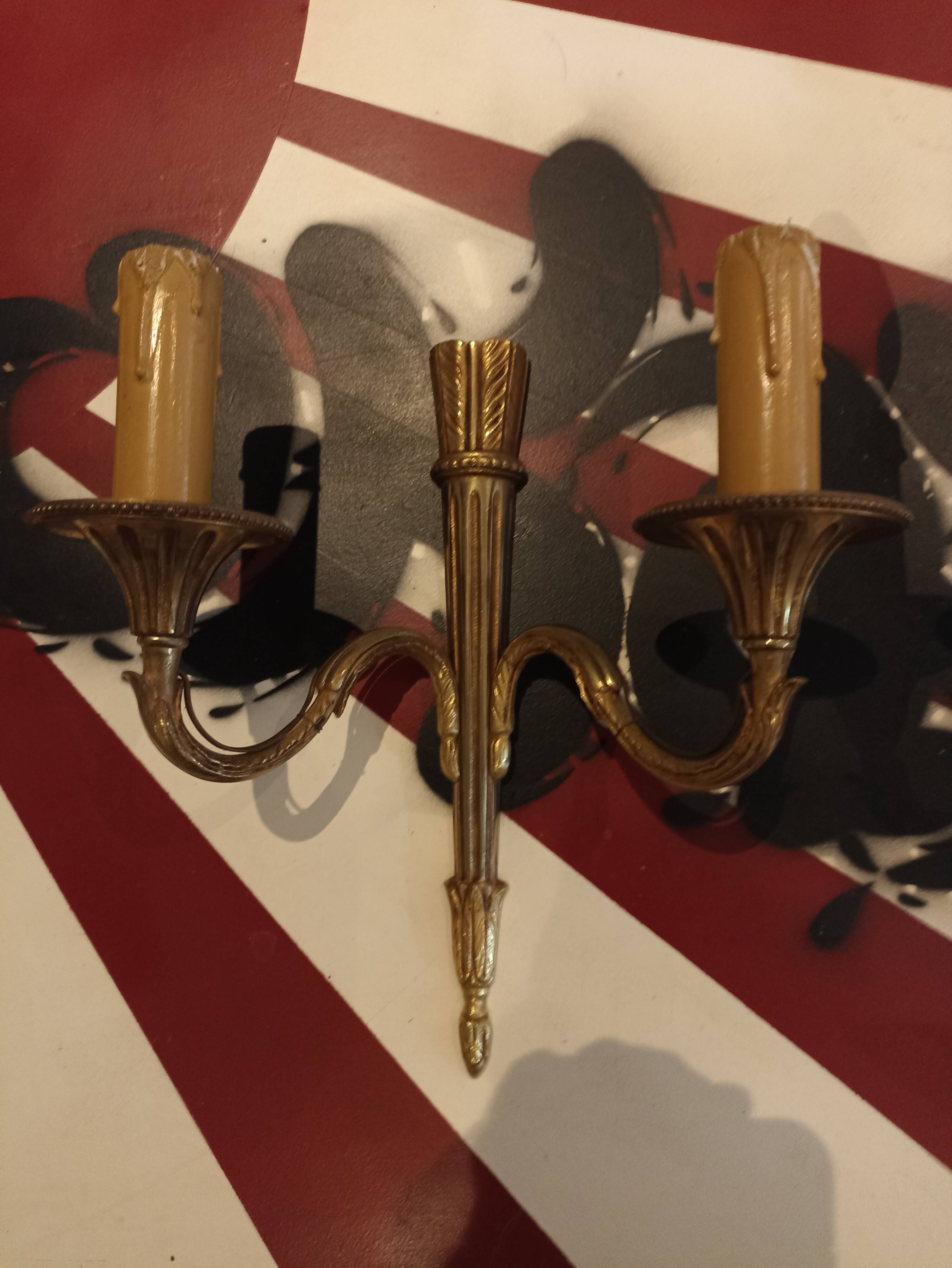 Pair of golden metal candlestick wall lamps