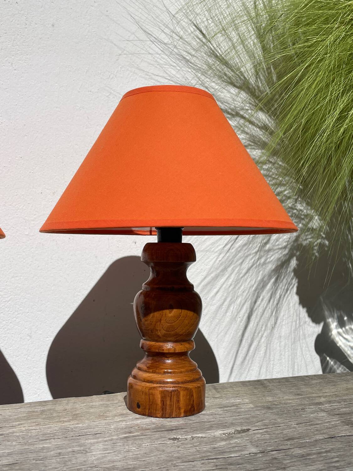 Pair of orange turned wood lamps
