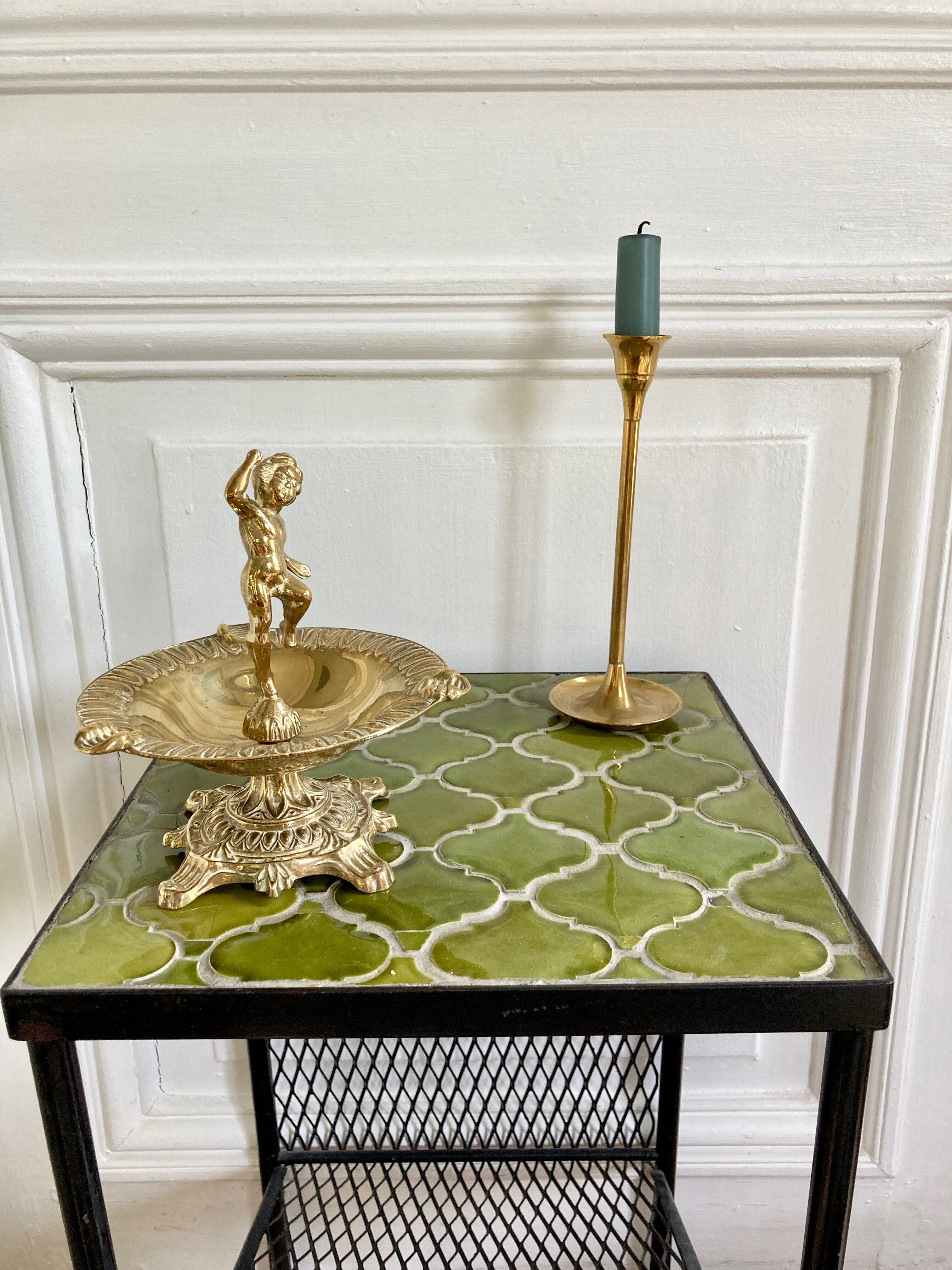 Brass cherub pocket-empty ashtray