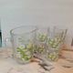 Orangeade service with a jug and six glasses featuring a daisy pattern.