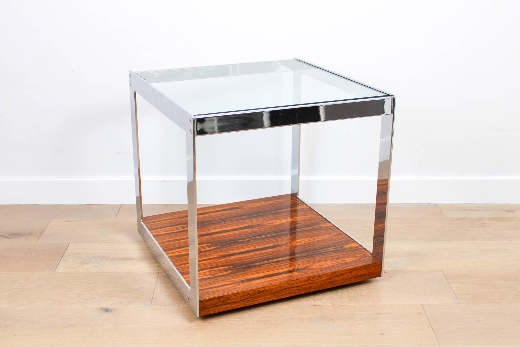 A vintage mid-century glass and rosewood side table by Merrow Associates