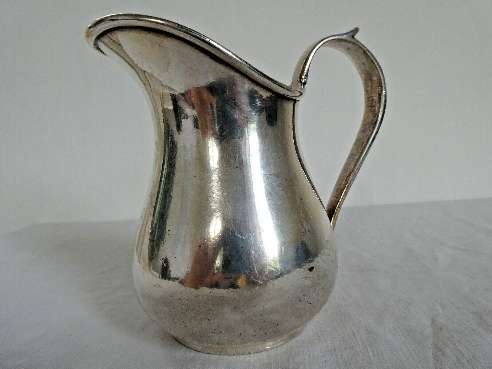 Silver metal milk jug