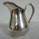 Silver metal milk jug