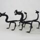 Paire de chenets de cheminée aux dragons en fer forgé