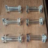 A set of 6 antique transparent trilobed glass knife holders