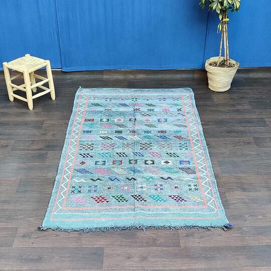 Faded blue Berber ethnic carpet