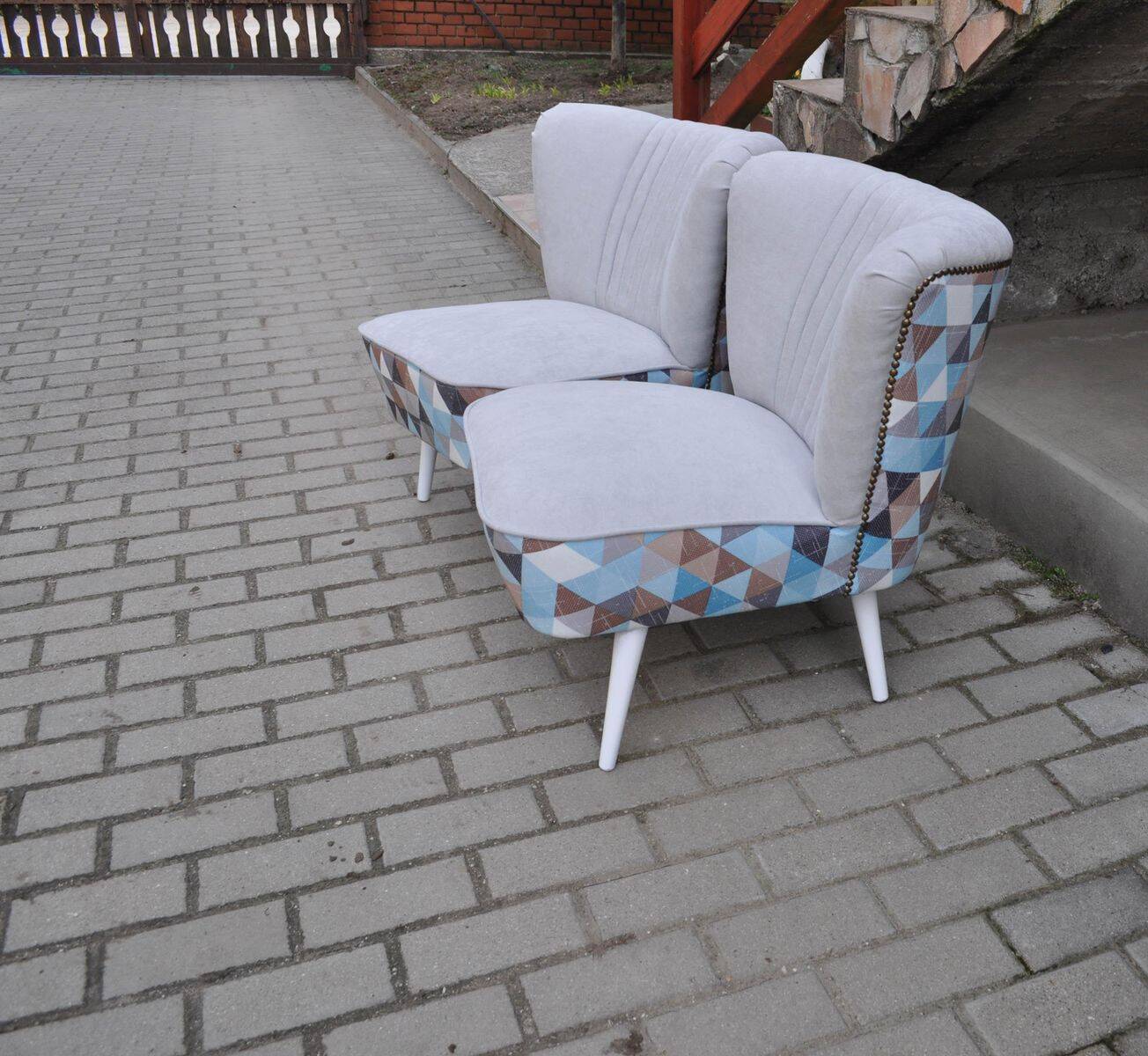 Set of 2 vintage multicoloured cocktail chairs in fabric and wood from the 1950s.
