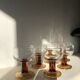 Lot of 9 glasses/cups from the 70s with amber feet