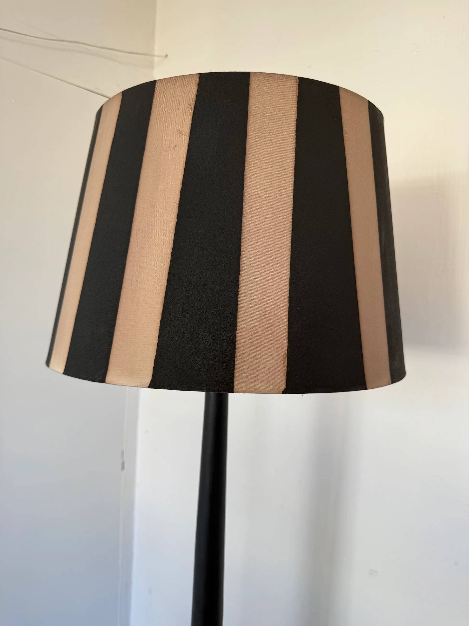 Vintage floor lamp in black patinated wood and striped lampshade
