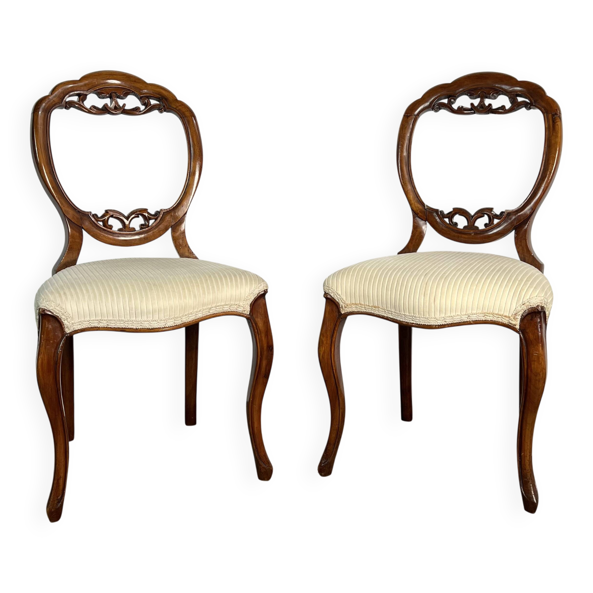 Pair of Victorian English chairs known as balloon chairs in solid mahogany.