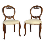 Pair of Victorian English chairs known as balloon chairs in solid mahogany.