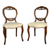 Pair of Victorian English chairs known as balloon chairs in solid mahogany.