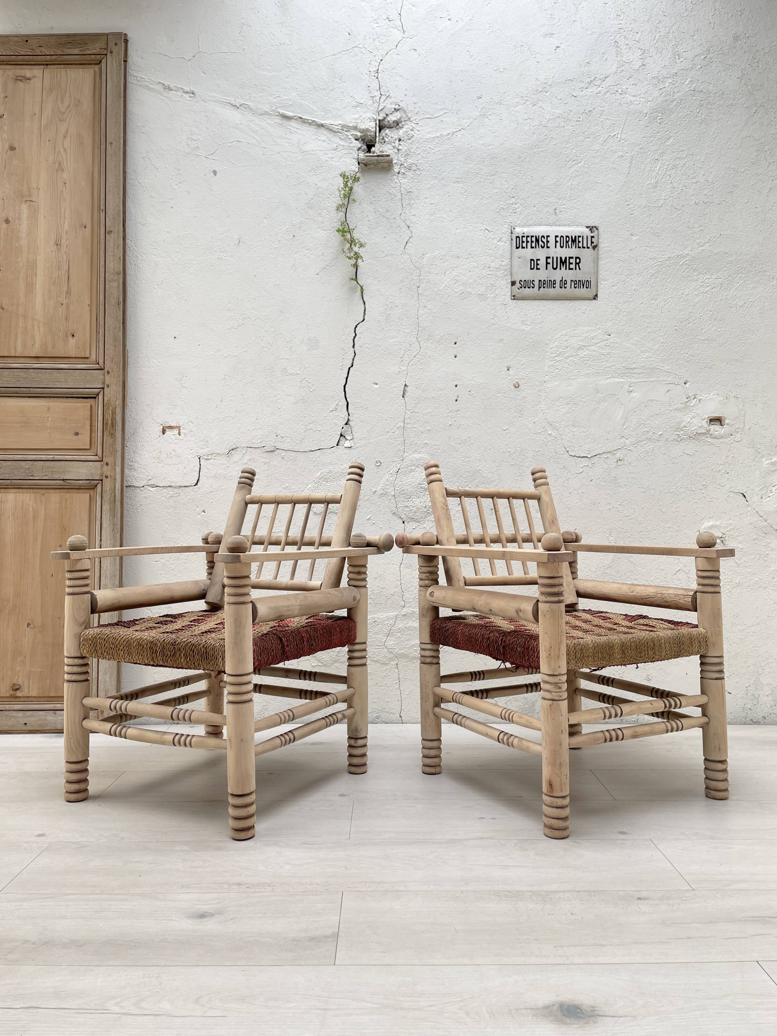 Pair of wooden armchairs and ropes