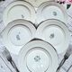 Old mismatched flat plates made of ironstone earthenware.