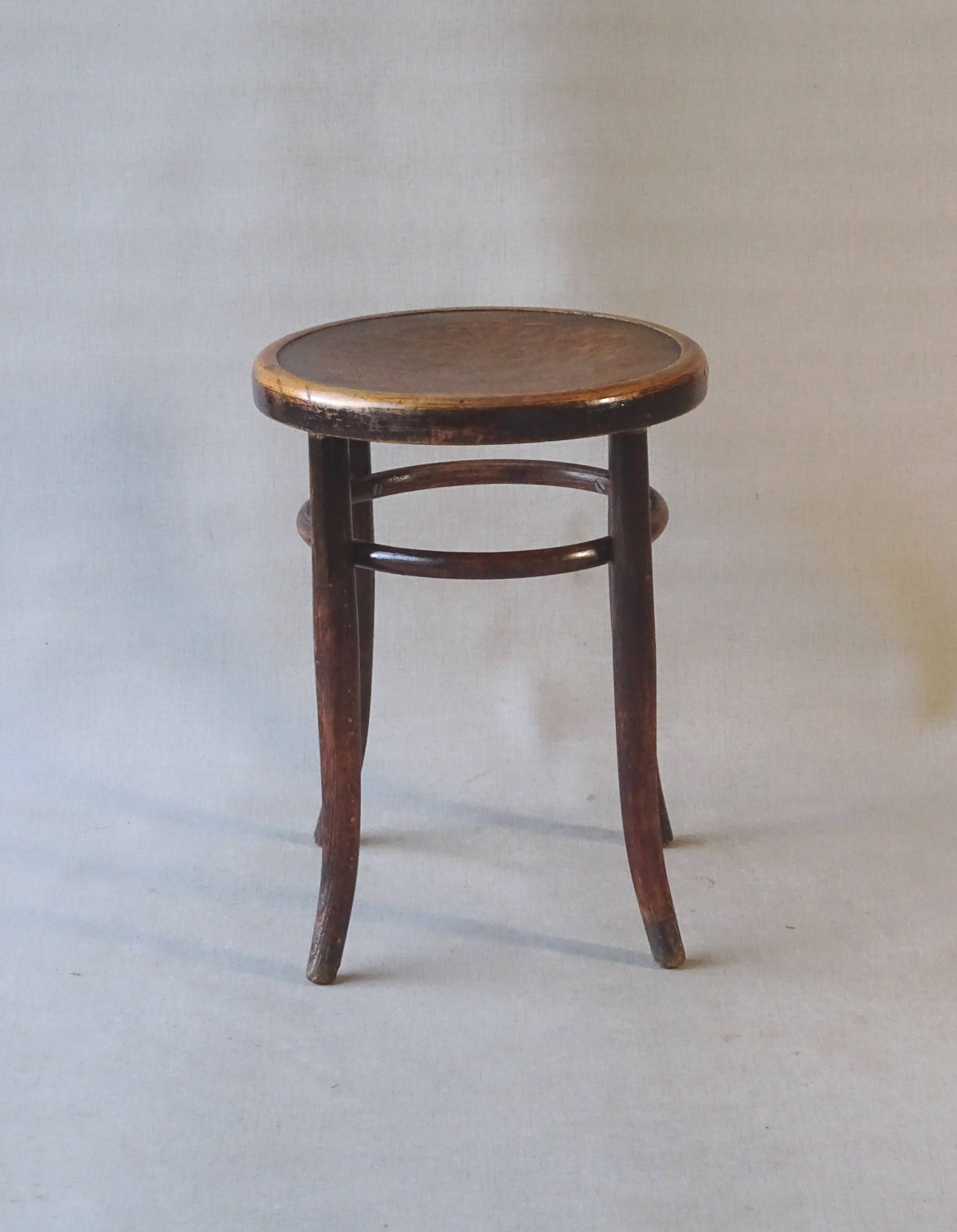 Fischel 1915 bistro stool, not Thonet, thermoformed seat.