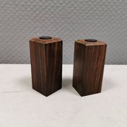 A set of salt and pepper shakers in rosewood