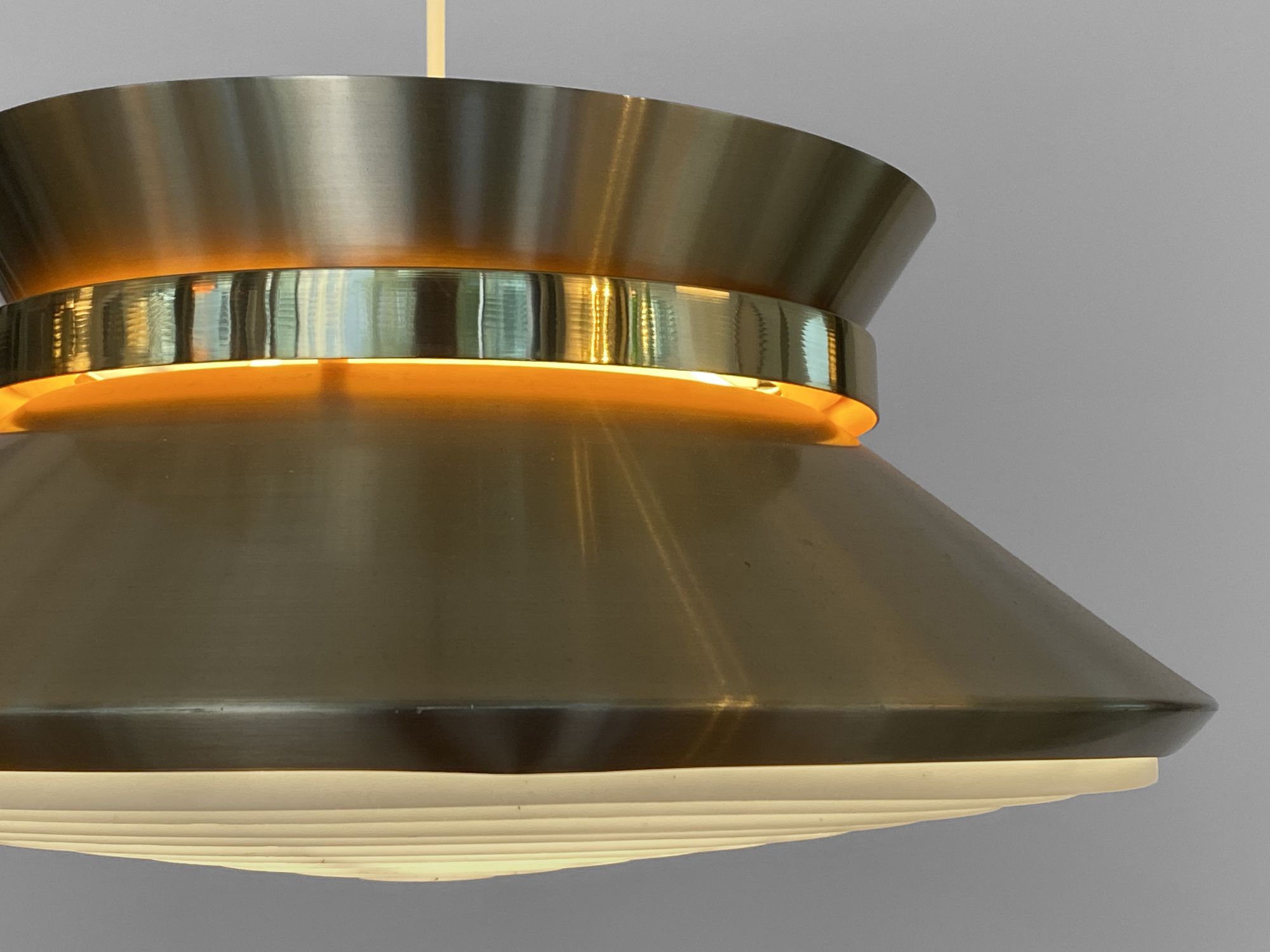 Brass colored aluminium pendant light by Carl Thore for Granhaga Metall. Sweden 1970s