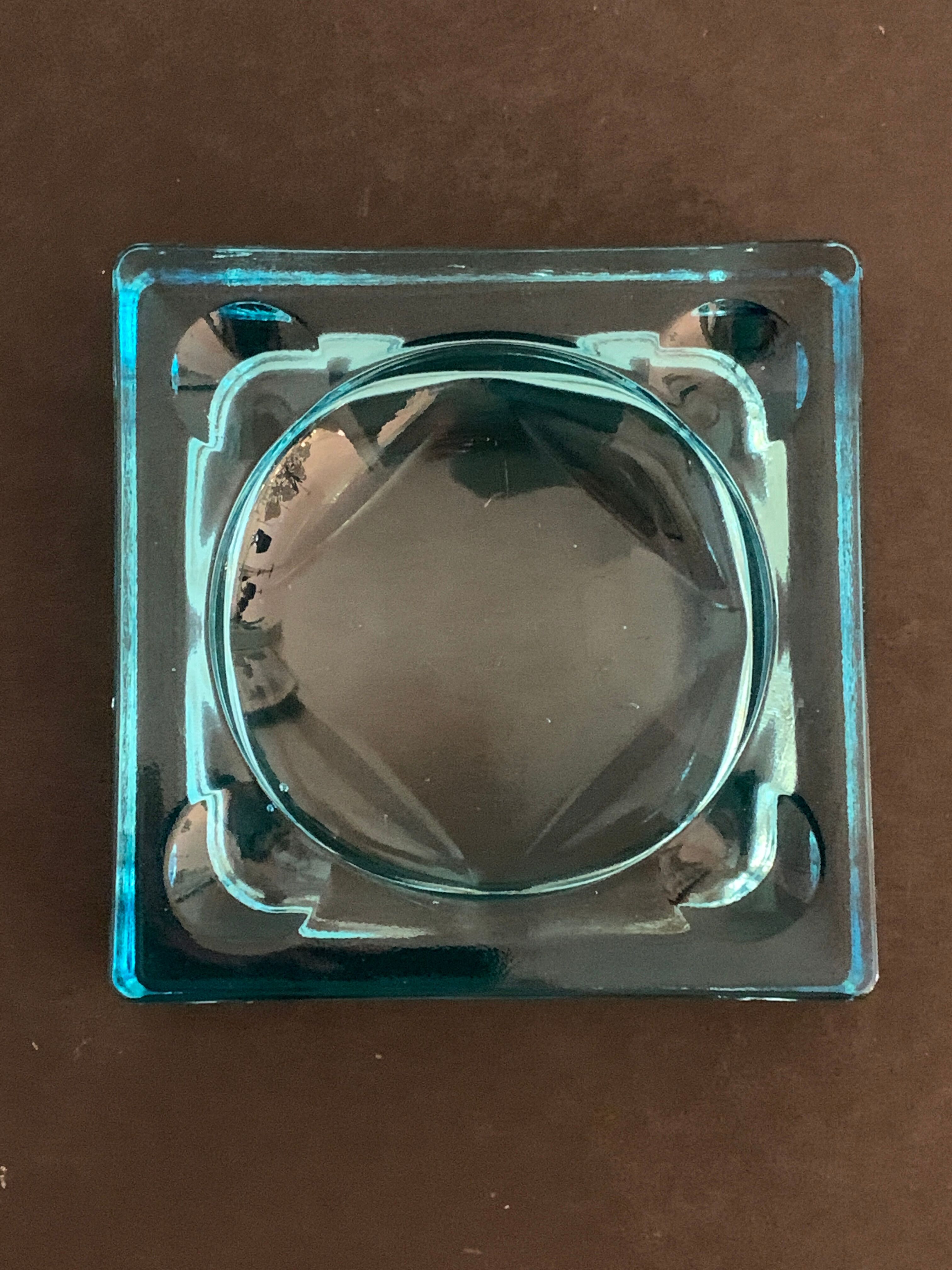 Ashtray paved in blue glass