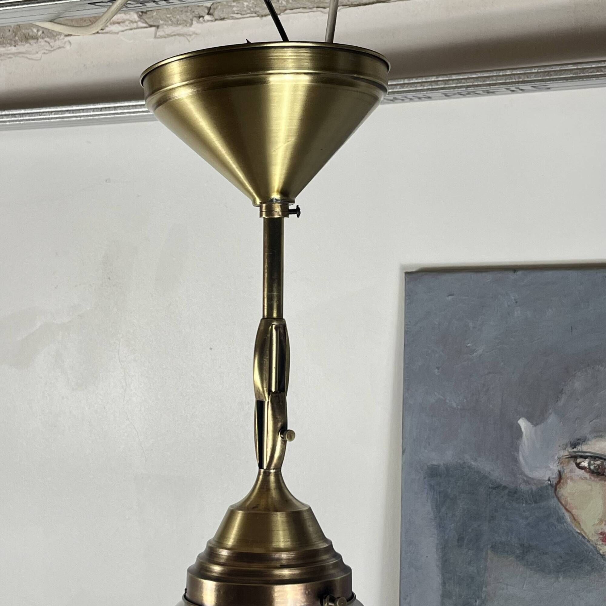 Pair of opaline glass pendant lights in white by Philips and brass from the 1920s.