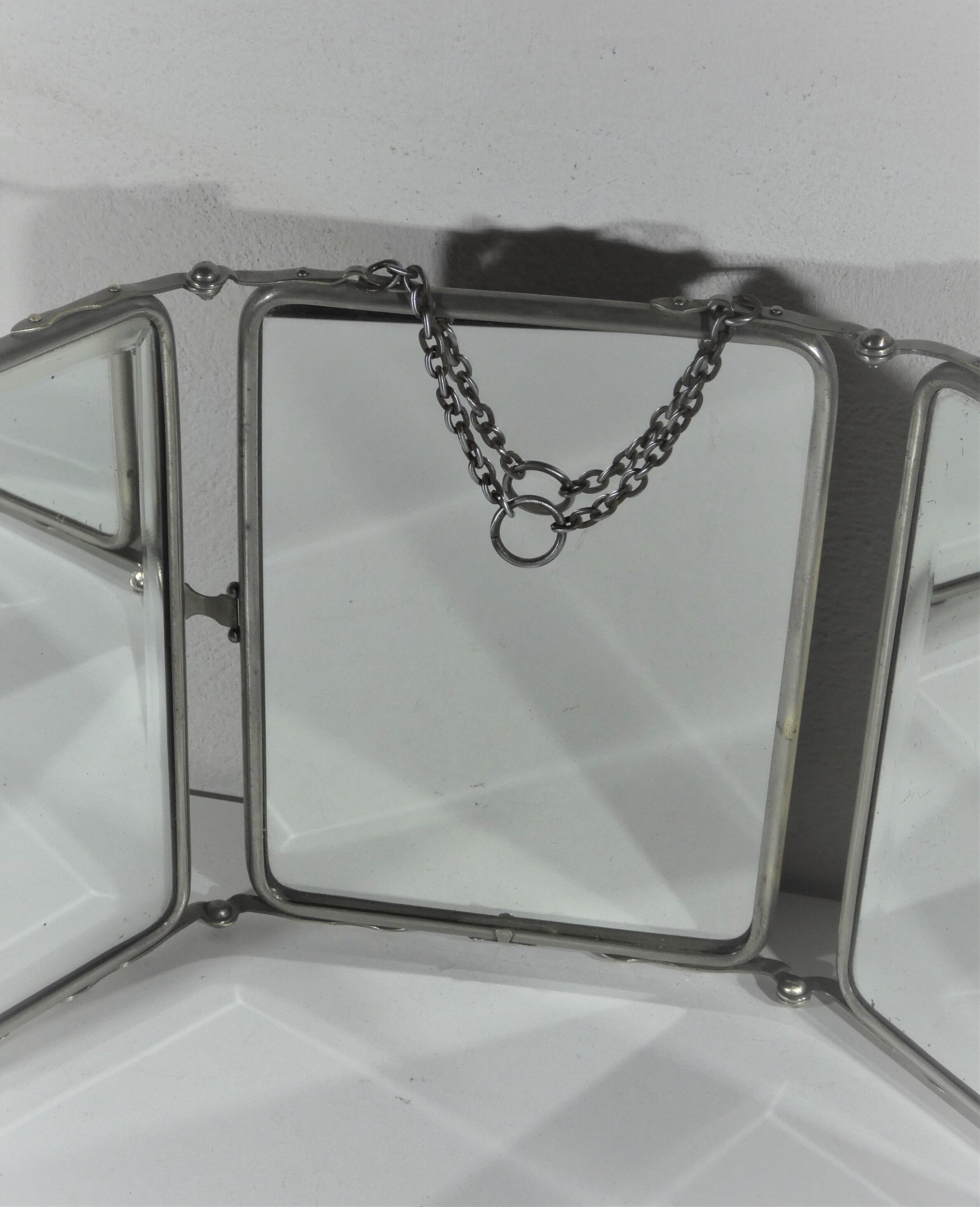 Tryptic barber mirror